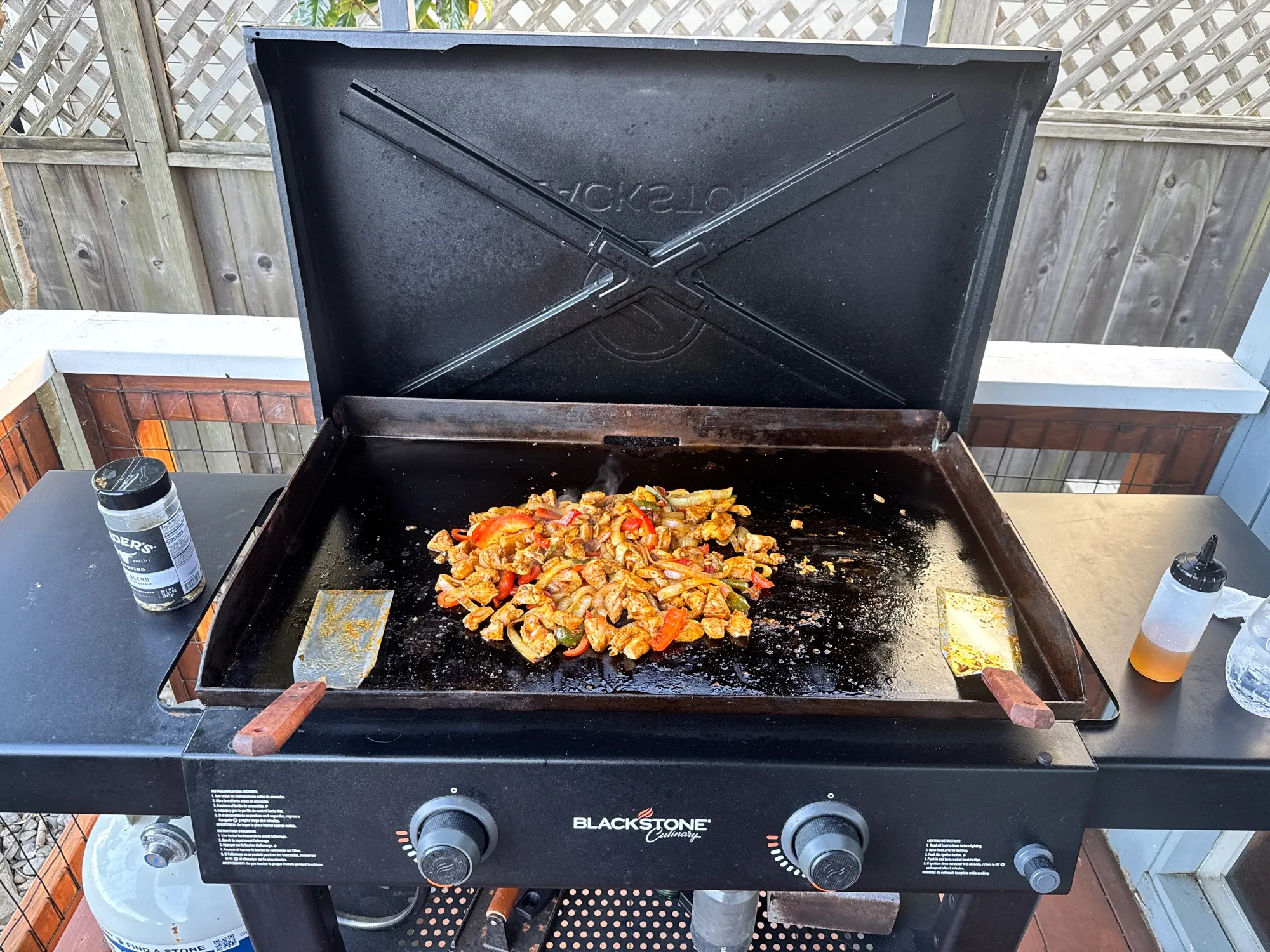 Chicken, peppers, and onions sizzling on the Blackstone griddle